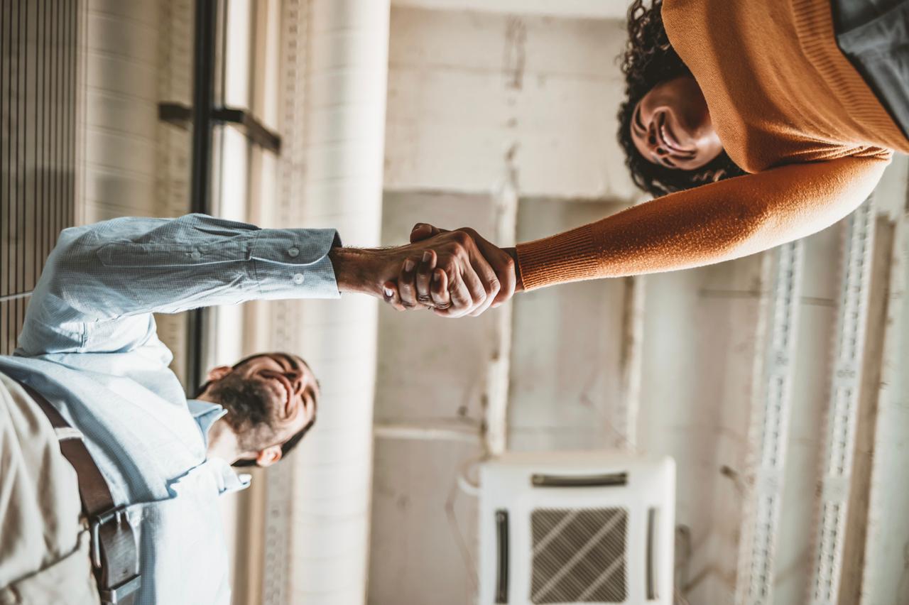 Business partnership handshake for a professional service relationship.